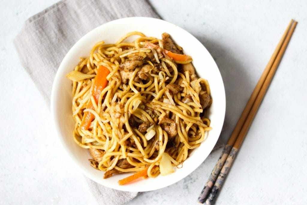 how to make chicken chow mein like the takeaway? Chow Mein is a classic takeaway favorite! Egg noodles and fried vegetables and tossed with a delicious sauce. With this simple recipe, you will forget where to place the release menu. This delicious and quick noodle recipe uses grocery ingredients to eat at the table quickly. The ingredients are seasoned with aromatic oils before being tossed with a sauce made from a few simple Asian ingredients, all of which you can find at your local grocery store. My Chinese home-cooked recipes are always a family favorite (and student favorite!), And much simpler than you think. Put down the shopping menu! This chicken chow mein recipe is delicious, delicious and very easy to make at home. This takeaway style recipe is made with the best home-made chow mein chicken sauce full of flavor. Every time I make chicken chow mein I get WOW I just do it this time: it tastes like takeaway! This simple recipe will leave you stunned because it tastes so good and you can make it in 20 minutes. Ideal for a Friday night fakeaway or midweek dinner you will want to eat. I don’t think I’ve ordered Chinese takeaway without ordering chicken main chicken, it’s a UK favorite take (and good recipe). It has been my favorite for many years, so I decided to try it out and be very happy that I did. This takeaway chicken recipe for chow mein flavor is very authentic. In addition, it will save you a lot of money and you can do it while you are waiting for your delivery to go with you. That is a win-win right here! Why You Will Love This Recipe Good for Left-Overs: Many authentic recipes for chicken chow mein are packed with bean sprouts, carrots and roasted cabbage. You can completely customize this recipe by using leftover vegetables in the fridge and leftover chicken. This recipe allows you to work with what you have and any vegetables you like. Save Money: This recipe is much cheaper than buying chicken mein chicken in your area, and you will get enough for two large plates or 3 small plates! Easy to Do: So it is not easy and straightforward; this style of taking from one pan chow mein is very easy to make. What Is Chow Mein Sauce Made? What makes a beautiful chow mein sauce for chow mein which is the best combo! This homemade sauce is what makes this chicken chicken mein a real flavor of Chinese style. Chow Mein sauce is made from black soy sauce, sesame oil, oyster sauce, vinegar, brown sugar, pepper and salt. What is the difference between Chicken Lo Mein and Chicken Chow Mein? Chow mein and Lo mein share many similarities such as egg noodles and having a small yellow tint in them. The main difference between the two depends on how they are cooked and how they are served. Lo mein noodles are boiled and steamed in a sauce, and softened in texture. In comparison, authentic recipes for chow mein noodles are usually fried until crispy before serving with a sauce. Recipe Ingredients The main ingredients in chow mein besides vegetable noodles, protein and home-made sauce. The ingredients listed below can be found in supermarkets (especially in the world food category), online or in Asian food stores. Noodles: Noodles are a staple in this home-cooked dish of chow mein sauce. There are many types of noodles you can use to make chicken mein chicken. Below I will tell you what I like to use and the best noodles to choose from. What are the best noodles to use in Chow Mein? Most of the time I like to use fresh egg noodles brought to the cool part of the store (next to frying sauces and vegetables). They are pre-cooked and only need to reheat by frying in a wok for a few minutes. It's an easy way to make chow mein and that's why you can do it quickly. Egg noodles are used in Chinese takeaways commonly, they are the preferred option and they are the best noodles you can use for chicken chow mein takeaway style recipe. I used dried noodles with egg noodles and they were white in color. After boiling in hot water for 5 minutes the dried noodles soften. Making chow mein with this type of noodle took a long time to make. The whole look of chow mein was not as brown as using egg noodles (but they were cheaper and I still enjoyed eating them). Vegetables: This chow mein fakeaway chicken recipe has bean sprouts, chopped cabbage and carrots. Almost every recipe has these essential ingredients inside. Adding spring onions and garlic adds to the delightful flavor. Chicken Chest: Chicken breast cut into long pieces is diluted with a mixture of garlic paste, ginger paste, black pepper, bicarbonate soda, salt and black soy sauce. Bicarb helps to soften meat. How Do You Make Chicken Chow Mein From The Beginning? Here is a step-by-step guide with pictures of how to make Chinese chicken chow mein with this recipe. Full recipe instructions are in below. Find out how to make this chicken mein (UK favorite takeeway) below with this fakeaway recipe. Step 1: Cut the chicken breast into long strips and place in a mixing dish.Add the suitable ingredients: garlic paste, ginger paste, black paper, bicarbonate of soda (baking soda), salt and black soy sauce in a mixing bowl. Stir until spread evenly and the chicken is completely wrapped in the marinade. Set the chicken apart for later use and chop your vegetables likes (carrot, cabbage, garlic and spring onions) for later use. Step 2: Make chow mein sauce by mixing oyster sauce, soy sauce, vinegar, brown sugar, sesame oil, kachili sauce and salt in a small bowl. Step Three: Heat a wok or frying pan in the middle to the top and add the oil. When it is hot, add the chicken breast and wrap and fry for 2 to 3 minutes or until cooked through and remove from the wok. Step Four: Put the oil in a clean wok or frying pan, remove the bean sprouts, chopped cabbage and carrots in a frying pan for 1 to 2 minutes or until soft and set aside for later use. Step Five: Add the oil to a clean wok or frying pan, sauté the onion for 1 minute before adding the garlic and sauté for one more minute. Then add the egg noodles inside and cook for 1 to 2 minutes.Add and mix the cooked chicken together, then add the chow mein sauce and mix until the sauce is evenly distributed. Lastly,add the cooked vegetables,mix well and serve. And done! That's the way to make chicken chow mein as a takeaway. Changes - Make Plain Chow Mein The steps to making chow mein are always the same regardless of what ingredients you extract or add. If you want to make a clear chow mein, just leave the chicken breast and marinade ingredients in this recipe. Also, feel free to play with vegetables! You just don’t need to stick to bean sprouts, cabbage and carrots. While not traditional, you can add more if you like. Key Ingredients for Takeaway Style Chow Mein: Chow Mein Noodles: Chow mein noodles are yellow and are made from wheat and egg. You can find them all grocery stores. And they often come in both fresh or dried. Follow the instructions on the package. Dried will need to be immersed or boiled in water first. New ones often need to be cleaned to remove flour or oil. Once cooked / soaked / cleaned, make sure you remove them well and set them aside to dry. This will ensure that you get a good fry in the noodles. Vegetables: With the traditional style of taking chow mein , I like to use carrots, green cabbage, green onions / spring onions and bean sprouts.When you cut them into small batons, they look like noodles and are completely mixed into a mixture. Vegetable oil: The oil has a spring or green onion flavor, making the whole kitchen smell like a takeway. An important step, so please do not skip or use a little oil. This is a fried noodle bowl; we need to add oil to fry the noodles and improve the taste. But it still comes in with the right amount of calories. Much better than a real takeaway! Oyster Sauce: This is easy to find at a grocery store. It is a rich brown sauce that adds a lot of flavor to your noodles.You can buy vegetable versions. Chinese Wine Cooking: You can find this in many grocery stores in the Asian region. Also known as Shaohsing Rice Cooking Wine, Shaoxing Wine, or Shaoxing Cooking Wine. If you do not find Chinese Cooking Wine, add dry sherry or sake instead if you have one. US Culture - Grams 8 green onions / green onions 4 tablespoons vegetable oil 2 cups shredded green cabbage 1 clove garlic - chopped 2 carrots 12 chow mein noodles 1 cup bean sprouts For Chow Mein Sauce: 2 teaspoons cornstarch 4 tablespoon soy sauce 4 teaspoons Chinese cooking wine 4 teaspoons oyster sauce ½ spoon of sugar ¼ spoon of white pepper Instructions Start by making a sauce: Combine the sauce ingredients in a small bowl or measuring cup. Stand on one side. 2 teaspoons cornstarch4 teaspoons soy sauce4 teaspoons Chinese cooking wine4 teaspoons oyster sauce½ teaspoon sugar¼ teaspoon white pepper Prepare vegetables and noodles: Finely chop the green onions / green onions into 2 "/ 5cm strips. Use white and green onion slices. 8 green onions / green onions Peel a squash, grate it and squeeze the juice. 2 carrots Prepare noodles as per instructions. If you use a new one, this is usually a bath or immersion in water for a minute. If you use dried, then usually boil for 3-4 minutes. But this packet is separate,so check yours. Make sure the noodles are well drained and set aside to dry Cooking Chow Mein. Place the chopped onion / green onion in a hot bowl. Heat all the oil in a large frying pan or wok. 4 tablespoons oil When smoking is hot, turn off the heat and pour the oil over the chopped onion. It will scream and spit like crazy! When the sizzling is done, drain the oil through a sieve, saving the spring onions later. Pour half of the oil into the pan and set on high heat. Add the chopped cabbage and carrot, and sauté over high heat until soft, about three minutes. Add the garlic and sauté for 30 seconds. 2 cups shredded green cabbage prepared carrots1 clove chopped garlic Remove the vegetables from the plate - See note 3 Add the remaining oil to the pan and let it cool. Add the noodles, stirring gently to grease the noodles in the oil. Once it is shiny and heated, return the vegetables to the pan and gently stir to combine. Add your prepared sauce, then place it in a pan, turn it over and keep stirring to coat the noodles in the sauce. Add the bean sprouts and spring onions and sauté for 30 seconds or until the bean sprouts have just begun to wither. 1 cup bean sprouts spring onions / green onions Serve immediately. Notes You will want to buy noodles that specifically say chow mein (or low mein). I prefer the new ones as they have a better tendency; here in Australia, I often buy Sweet Noodles - Chow Mein Noodles. They taste good, they look good, and they only need to be immersed for one minute in boiling water. If you can only buy dried egg noodles, do not panic. Just cook them as directed in the package. Also make sure they are drained and dried before cooking chow mein. Chinese Wine Cooking is also known as Chinese Rice Wine, Shaohsing Rice Cooking Wine, Shaoxing Wine, or Shaoxing Cooking Wine. You can find this in most of the restaurants in the Asian section. Do not mix it with rice wine vinegar, as that will damage your stir fry !!! If you do not find Chinese Cooking Wine, you can use dry sherry. I remove the vegetables from the pan as it starts to get very hard to cover everything without losing food at the edges. If you have a large frying pan or wok, you can store everything in the pan. Nutrition CALORIES: 485kcal | CARBOHYDRATES: 70g | Protein: 15g | OIL: 16g | OIL FAT: 1g | POLYUNSATURATED OIL: 4g | MONOUNSATURATED OIL: 9g | TRANS OIL: 1g | ISODIUM: 664mg | POTASIUM: 282mg | FIBER: 8g | SUGAR: 6g | VITAMIN A: 5374IU | VITAMIN C: 23mg | CALCIUM: 50mg | IRON: 4mg